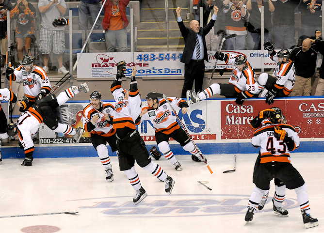 The Komet bench charges onto the ice to celebrate, right after the Komets won the Turner Cup 3-2 in the 3rd overtime period against the Port Huron Icehawks at Memorial Coliseum Monday night.