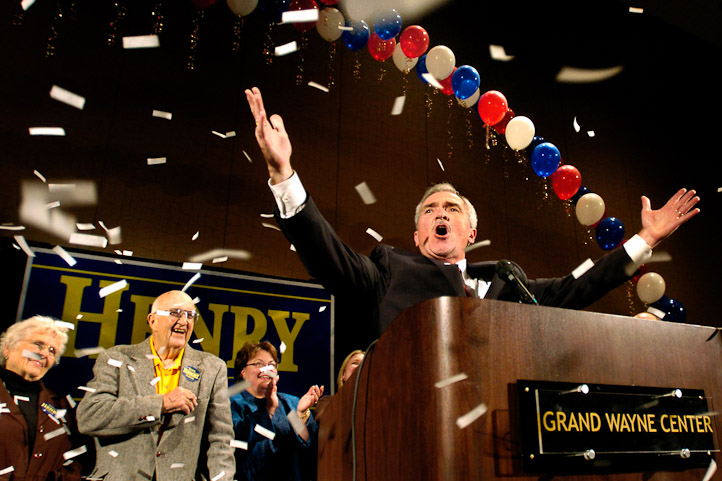 Mayor-elect Tom Henry, right, accepts the cheers of  his supporters during his speach at the Grand Wayne Center Tuesday night.