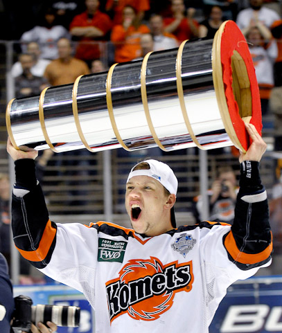 Komet defenceman Sergei Durdin shows the Turner Cup to the crowd after the Komets won the Turner Cup 3-2 in the 3rd overtime period against the Port Huron Icehawks at Memorial Coliseum Monday night.