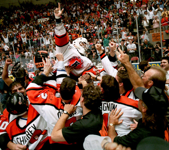 Fort Wayne Komets goalie Pokey Reddick, MVP of the 1993 International Hockey League playoffs, is lifted onto his teammates' shoulders after the final buzzer of the Turner Cup-clinching 6-1 victory over San Diego. The Komets were a perfect 12-0 during the playoffs that year.